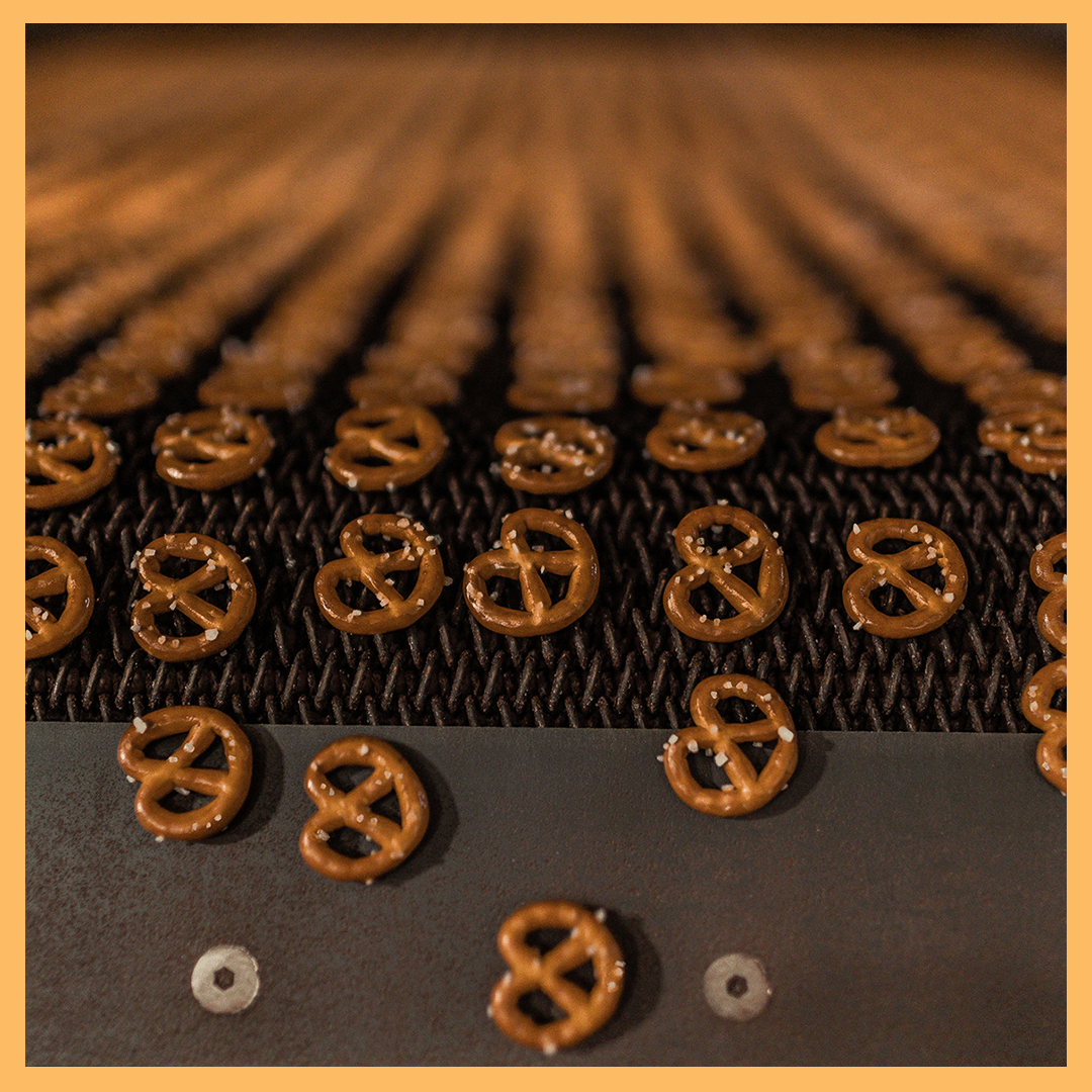 Pretzel minis exiting an RBS tunnel oven.